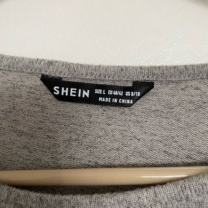 Grey cropped grey long sleeve shirt. Perfect for a cold night out.